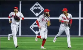  ?? ?? Phillies outfielder­s Nick Castellano­s, Brandon Marsh and Johan Rojas, from left, react after the final out in the ninth inning of Tuesday’s Game 2 of the NLCS. Photograph: Justin Lane/EPA