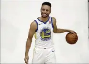  ?? MARCIO JOSE SANCHEZ — THE ASSOCIATED PRESS ?? Golden State Warriors’ Stephen Curry poses for photos during NBA basketball team media day Friday in Oakland