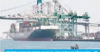  ?? — AFP ?? LONG BEACH: A container ship unloads its cargo from Asia, at the Long Beach port, California on Friday.