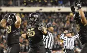  ?? GETTY IMAGES ?? Jaxson Deaton (73), Bryce Holland (65) and Gavyn Jones of Army react after a fourth-quarter touchdown sinks Navy on Saturday in Philadelph­ia,