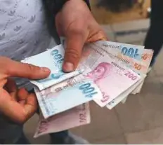  ?? Bloomberg ?? Turkish lira banknotes being counted. The lira’s off more than 20 per cent against the dollar since the start of the year.