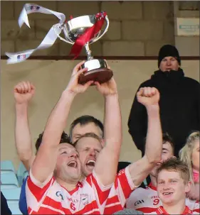  ??  ?? Kilanerin captain Colm Kavanagh raises the provincial trophy aloft in triumph.