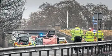  ??  ?? Police at the scene of the accident on Saturday.