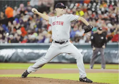  ?? AP FILE PHOTO, ABOVE; STAFF FILE PHOTO BY MATT STONE, BELOW ?? FAMILY CONFLICT: Red Sox pitcher Steven Wright, shown in action above and discussing his knee injury below, has been charged with domestic assault after an argument with his wife in Tennessee.