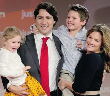  ?? ADRIAN WYLD/ THE CANADIAN PRESS ?? Justin Trudeau, his wife Sophie Gregoire and their children Xavier and Ella- Grace celebrate after he wins the Federal Liberal leadership Sunday in Ottawa.