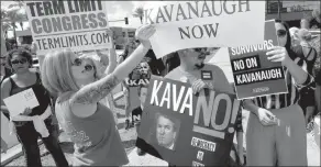  ?? MATT YORK / ASSOCIATED PRESS ?? A counter-protester, left, replies to people protesting against U.S. Supreme Court nominee Brett Kavanaugh on Thursday outside the Phoenix office of Sen. Jeff Flake, R-ariz.