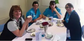  ??  ?? Well deserved The Hospice@Home team enjoy a well earned cuppa at the anniversar­y celebratio­ns.