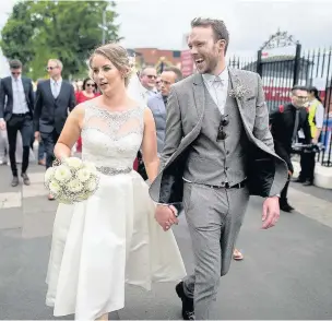  ??  ?? ●●Groom Pete Richards and bride Abby Turner at the Emirates Old Trafford Stadium Joel Goodman