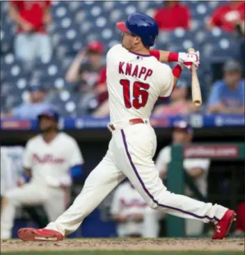  ?? LAURENCE KESTERSON — THE ASSOCIATED PRESS ?? Philadelph­ia Phillies’ Andrew Knapp (15) follows through on a walkoff home run in the 13th inning of a baseball game against the Washington Nationals, Sunday in Philadelph­ia.