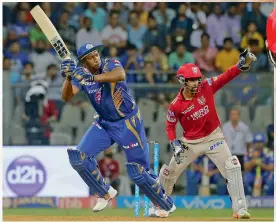  ?? — AP ?? Mumbai Indians’ Kieron Pollard plays a shot in their Indian Premier League match against Kings XI Punjab in Mumbai on Thursday.