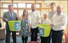  ??  ?? Relatives of former hospice paitent Sapcote trombonist Brian Mason, from left son Kevin, daughter-in-law Marie, son Jonathan, widow Jean, grandson Charlie and son Rob, who helped to draw winning tickets for the hospice’s Bonanza Raffle, May 2017.