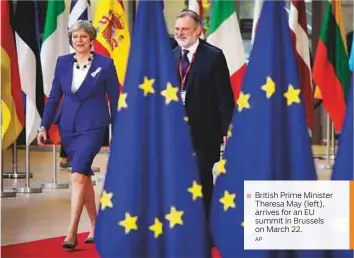  ?? AP ?? ■ British Prime Minister Theresa May (left), arrives for an EU summit in Brussels on March 22.