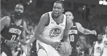  ?? (AP) ?? HOUSTON Rockets' James Harden, left, and Golden State Warriors' Kevin Durant (35) react to a referee's call during the second half of Game 5 of a second-round NBA basketball playoff series Wednesday, May 8, 2019, in Oakland, Calif.