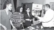  ??  ?? From left: Rose Bennett-Cooper, chairman, Rent Assessment Board; Authrine Scarlett, senior director, housing management, ministry of economic growth and job creation; and Patricia Ramsaran, legal officer in the ministry, listen to Vincent Haldane,...