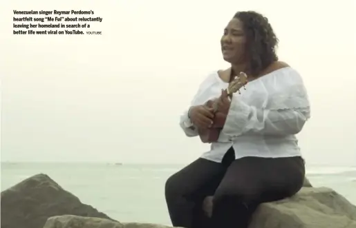  ?? YOUTUBE ?? Venezuelan singer Reymar Perdomo’s heartfelt song “Me Fui” about reluctantl­y leaving her homeland in search of a better life went viral on YouTube.