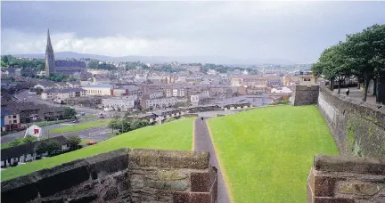  ?? DAVID C. HOERLEIN ?? Derry's 17th-century ramparts create a walkway around the old city in Northern Ireland.