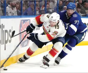  ?? Florida Panthers left wing Matthew Tkachuk (moves the puck ahead of Tampa Bay Lightning defenseman Victor Hedman during Game 3 of the Stanley Cup first-round series Thursday in Tampa. ?? THE ASSOCIATED PRESS