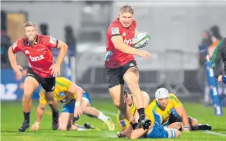  ?? Picture / Getty Images ?? Jack Goodhue scored two tries for the Crusaders last night.