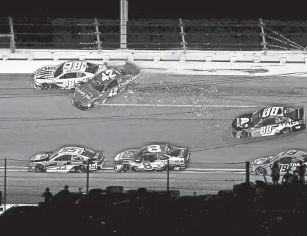  ?? JASEN VINLOVE/USA TODAY SPORTS ?? Matt Kenseth (42) and Jimmie Johnson (48) wreck Saturday during the Coke Zero Sugar 400 at Daytona Internatio­nal Speedway.