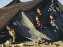  ??  ?? Afghan children at a camp for internally displaced people in the Injil district of Herat province in August AFP