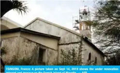  ??  ?? TSINGONI, France: A picture taken on Sept 14, 2019 shows the under renovation minaret and mosque on the French island of Mayotte. — AFP