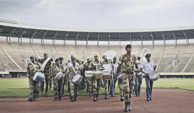  ?? PICTURE; AFP ?? 0 A military band parades during a rehearsal ahead of the presidenti­al inaugurati­on of Emmerson Mnangagwa in Harare