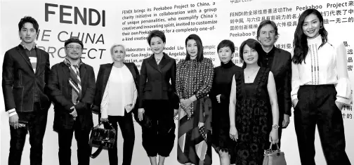  ?? PHOTOS PROVIDED TO CHINA DAILY ?? Pietro Beccari (second right), CEO and chairman of Fendi, with Chinese celebritie­s, including Liu Wen (first right), Liang Yuanwei (fourth right), Guo Jingjing (center), Yang Lan (fourth left) and Tim Yip (second left), who are involved in Fendi’s...