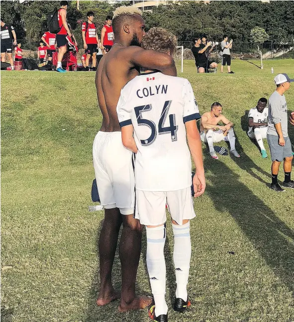  ?? — WHITECAPS INSTAGRAM ?? Kendall Waston gives 15-year-old Whitecaps residency player Simon Colyn a hug after he made his team debut in Hawaii.