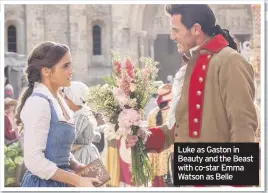  ??  ?? Luke as Gaston in Beauty and the Beast with co-star Emma Watson as Belle