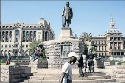  ?? PHOTO: STEFAN HEUNIS/AFP ?? TROUBLE BREWING: People visit the defaced statue of Paul Kruger in Church Square, Pretoria. South Africa has seen a new wave of anti-colonialis­t protests with calls for certain statues and monuments to be removed