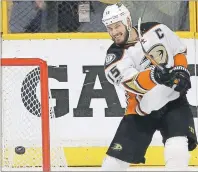  ?? AP PHOTO ?? Anaheim Ducks centre Ryan Getzlaf knocks the puck away from the net in anger after Nashville Predators left-winger Austin Watson scored an empty-net goal during the third period in Game 6 of the Western Conference final Monday in Nashville, Tenn.