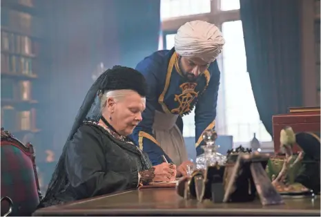  ?? PETER MOUNTAIN, FOCUS FEATURES ?? Judi Dench stars as Queen Victoria and Ali Fazal is Abdul Karim in Victoria & Abdul, which is based on a true story.