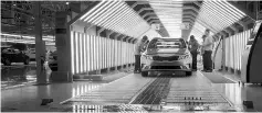  ?? — WP-Bloomberg photo ?? Workers inspect a vehicle after a rain test at the Kia Motor Corp. assembly plant in Pesqueria, Mexico, on May 24.