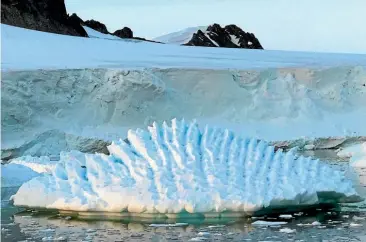 ?? UNIVERSITY OF LEEDS/AP ?? This photo by researcher Andrew Shepherd shows an unusual iceberg melting pattern on the Antarctic Peninsula. A new study has found that the melting of Antarctica is accelerati­ng at an alarming rate.