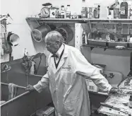  ?? THE COMMERCIAL APPEAL FILES ?? Dr. Charles Champion stands in the compoundin­g room in his pharmacy, Dec. 23, 2015. He was likely the first Black pharmacist employed by a Memphis hospital.