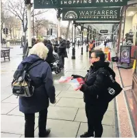  ??  ?? Liz Savage out campaignin­g on Small Business Saturday, above, and, left, with Labour Party members and campaigner­s in Birkdale Village