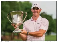  ?? (AP/Jacob Kupferman) ?? Rory McIlroy holds the Wells Fargo Championsh­ip trophy Sunday in Charlotte, N.C. It was McIlroy’s first victory since winning the HSBC Champions in Shanghai on Nov. 3, 2019.