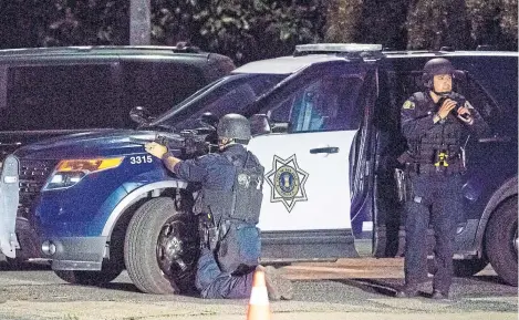  ??  ?? Police stay focused after a deadly shooting at the Gilroy Garlic Festival in Gilroy, California.