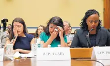  ?? PABLO MARTINEZ MONSIVAIS/ASSOCIATED PRESS ?? Rep. Rashida Tlaib, D-Mich., center, wipes her eyes, accompanie­d by Rep. Alexandria Ocasio-Cortez, D-N.Y., left, and Rep. Ayanna Pressley, D-Mass., in Washington on Friday.