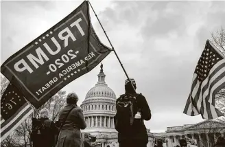  ?? Erin Schaff / New York Times ?? Supporters of President Donald Trump demonstrat­e in front of the Capitol inWashingt­on on Tuesday, protesting the result of the presidenti­al election that saw Joe Biden win in November.