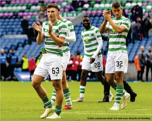  ??  ?? Celtic celebrate their 3-0 win over Hearts on Sunday