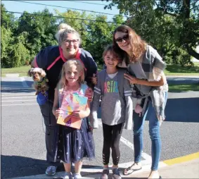  ?? LAUREN HALLIGAN - MEDIANEWS GROUP ?? Along with parents, some students’ pets came to see them off into the new school year at Division Street Elementary School.