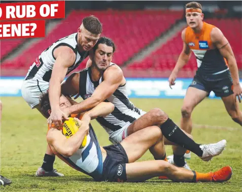  ??  ?? PLAY ON: Toby Greene is tackled by Magpies Taylor Adams and Brodie Grundy on Friday night.
Picture: AAP