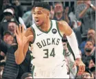  ?? ?? FREAK SHOW:Giannis Antetokoun­mpo reacts after a basket on his way to a franchise-record 64 points.