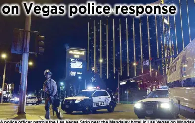  ?? AP ?? A police officer patrols the Las Vegas Strip near the Mandalay hotel in Las Vegas on Monday.