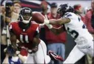  ?? DAVE MARTIN — AP FILE ?? In this 2013 file photo, Falcons wide receiver Julio Jones, left, misses a catch as Seahawks cornerback Richard Sherman defends during the first half of game in Atlanta. No individual matchup will top the expected matchup between Jones and Sherman when...