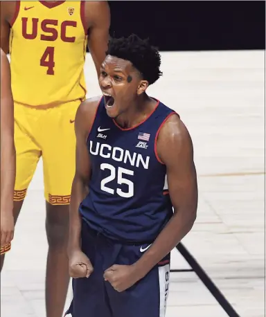  ?? Jessica Hill / Associated Press ?? UConn’s Josh Carlton (25) reacts to a call in the Huskies favor during Thursday’s win over Southern California in Uncasville.