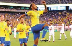  ?? USA TODAY Sports ?? Brazil forward Neymar celebrates after scoring through a ■ penalty against the US at MetLife Stadium.
