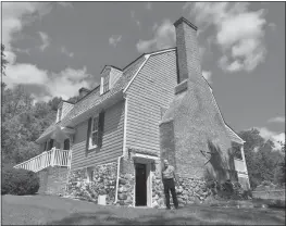  ?? STAFF PHOTO BY DARWIN WEIGEL ?? George Gazarek, president and founder of Friends of Maxwell Hall, stands outside the 18th century home in Hughesvill­e. The 1 1/2 story, gambrel-roofed home was restored in the 1980s by Edwin and Marion Swann.