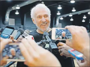  ?? AP PHOTO ?? San Antonio Spurs coach Gregg Popovich addresses the media during an NBA news conference, Tuesday, July 12, in San Antonio, the day after Tim Duncan announced his retirement. Popovich wore a T-shirt with the likeness of Duncan as he reflected on his...